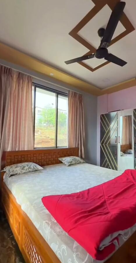 Bedroom at Nakshatra Villa with a diamond-patterned ceiling