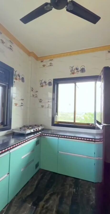 Mint-toned kitchen at Nakshatra Villa