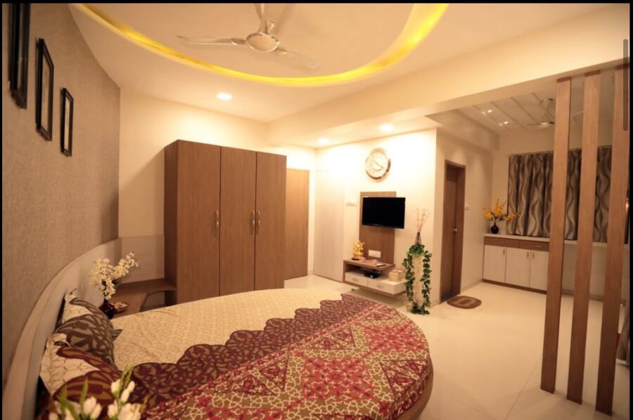 Luxury bedroom at White House with round bed and ring-lit ceiling