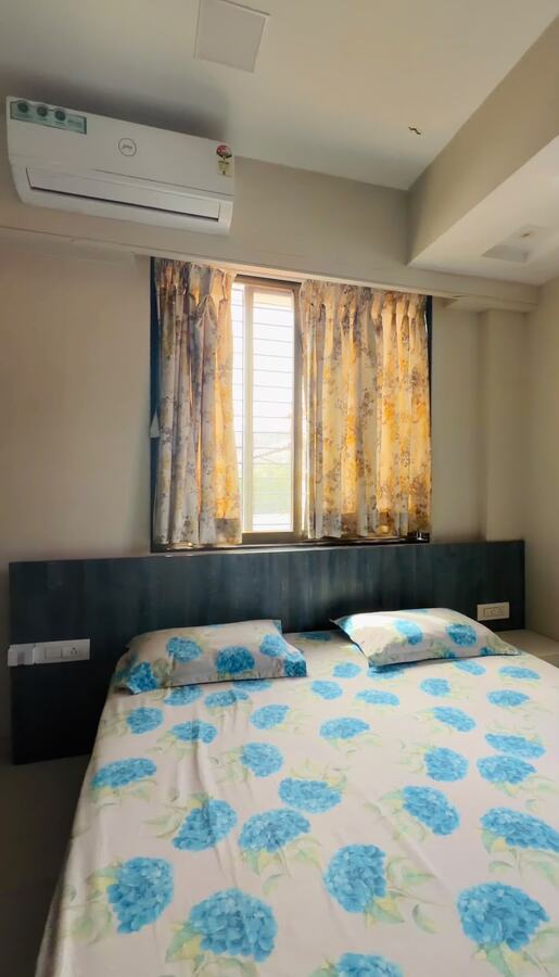 Bedroom with blue floral bedspread at White House