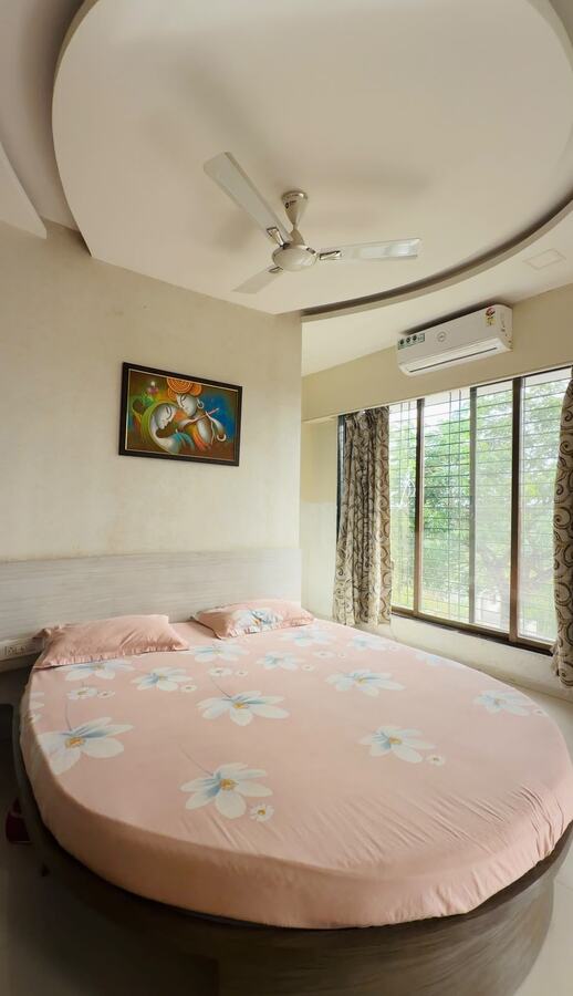 Round bed bedroom in pink floral linen at White House