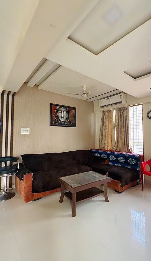 Living room at White House with cream sofa and wall art